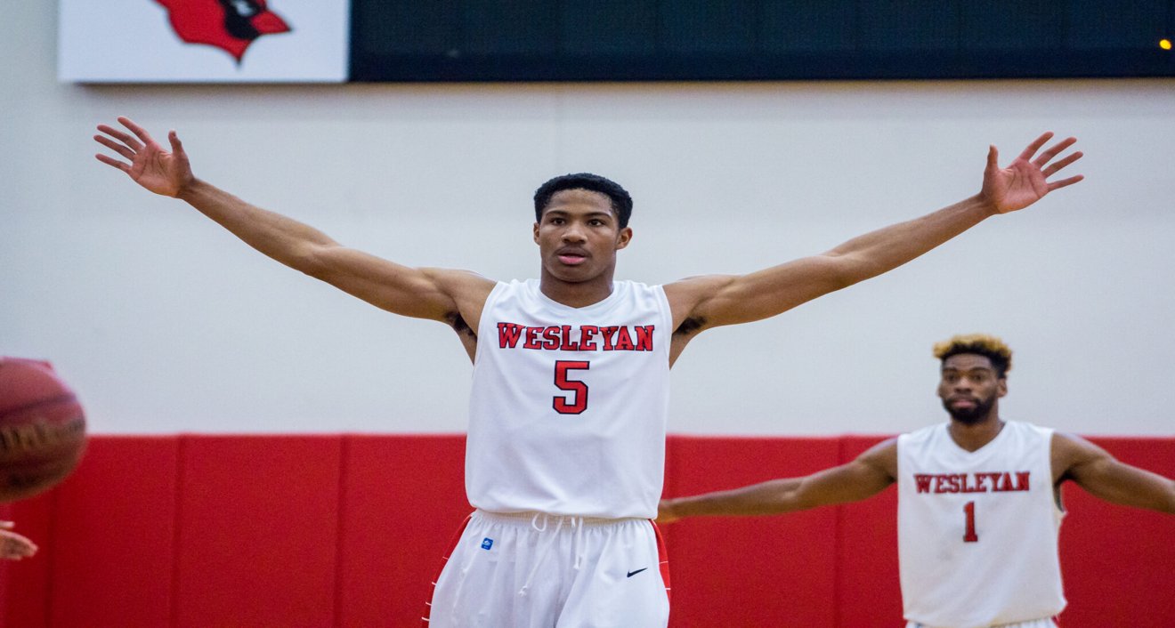 Jordan Sears ’18 (left) playing basketball at Wesleyan. Sears is now head coach of the Texas Legends, the G-League Affiliate of the Dallas Mavericks.