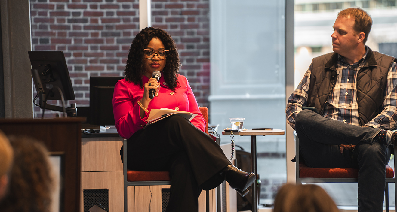 Khalilah Brown-Dean leads a panel discussion on building communities.