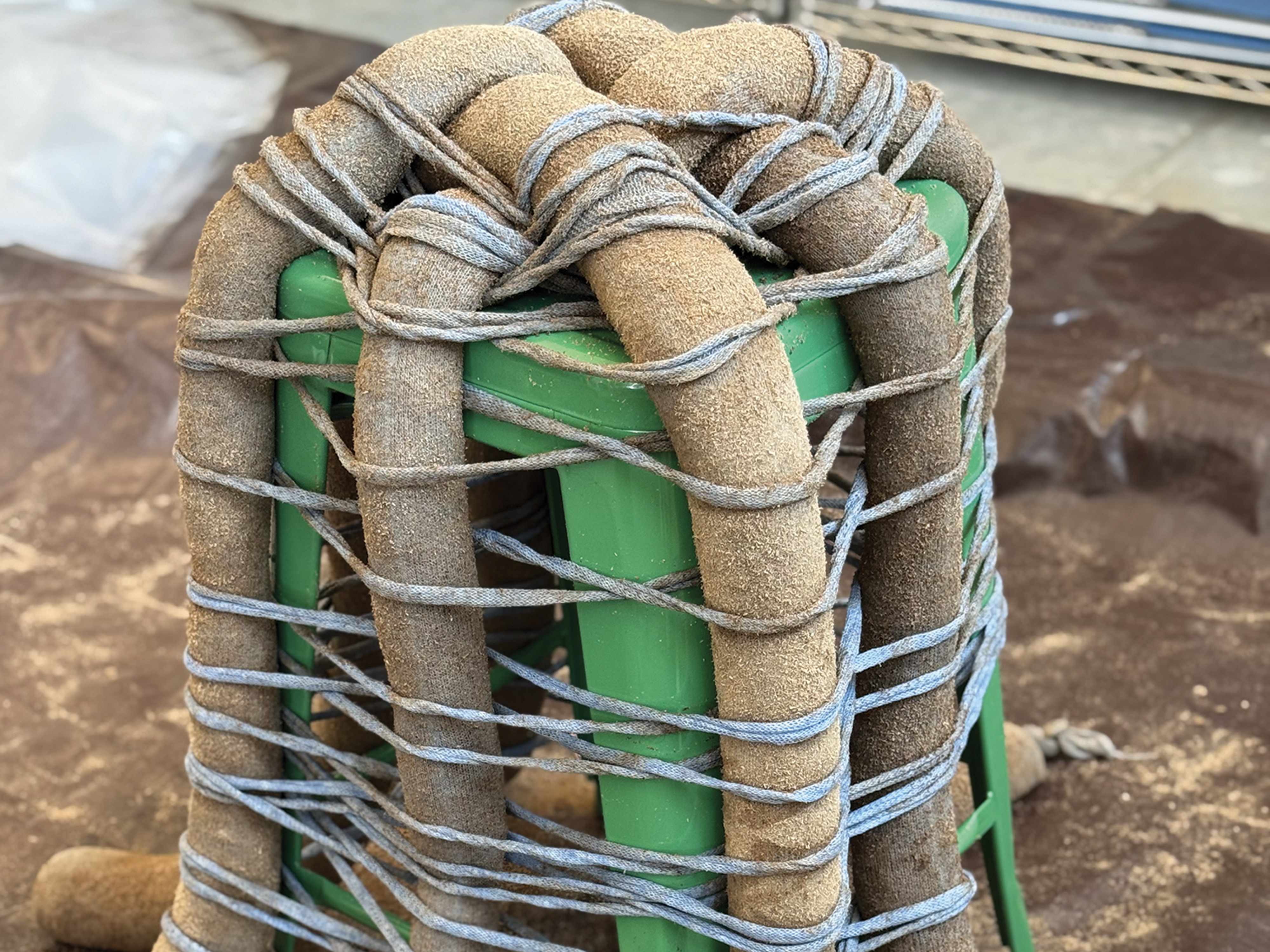 tubing around a green stool