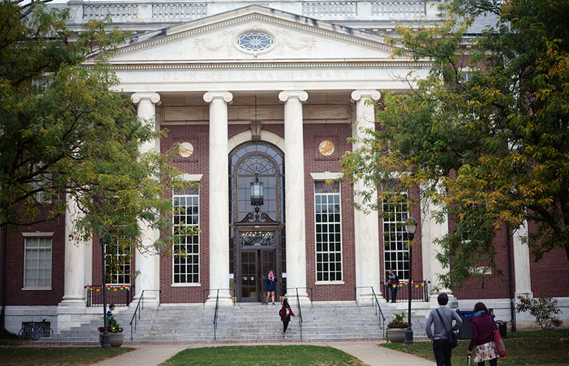 Olin Library front entrance with people entering