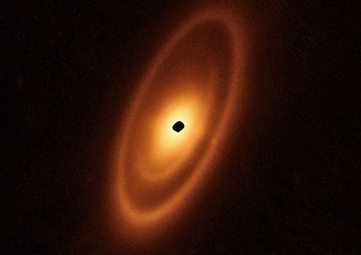 A dusty debris disk surrounds the young star Fomalhaut